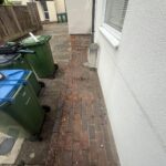 Image shows the outside of the front door of a house before a modular ramp is installed